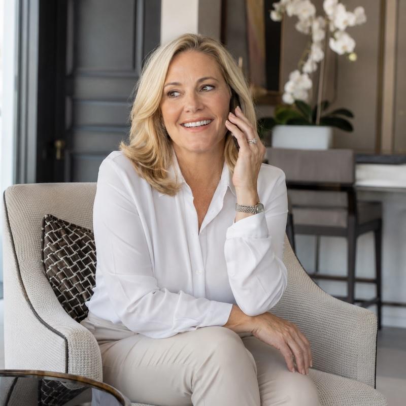 Business owner taking a call, relaxed knowing every call is answered